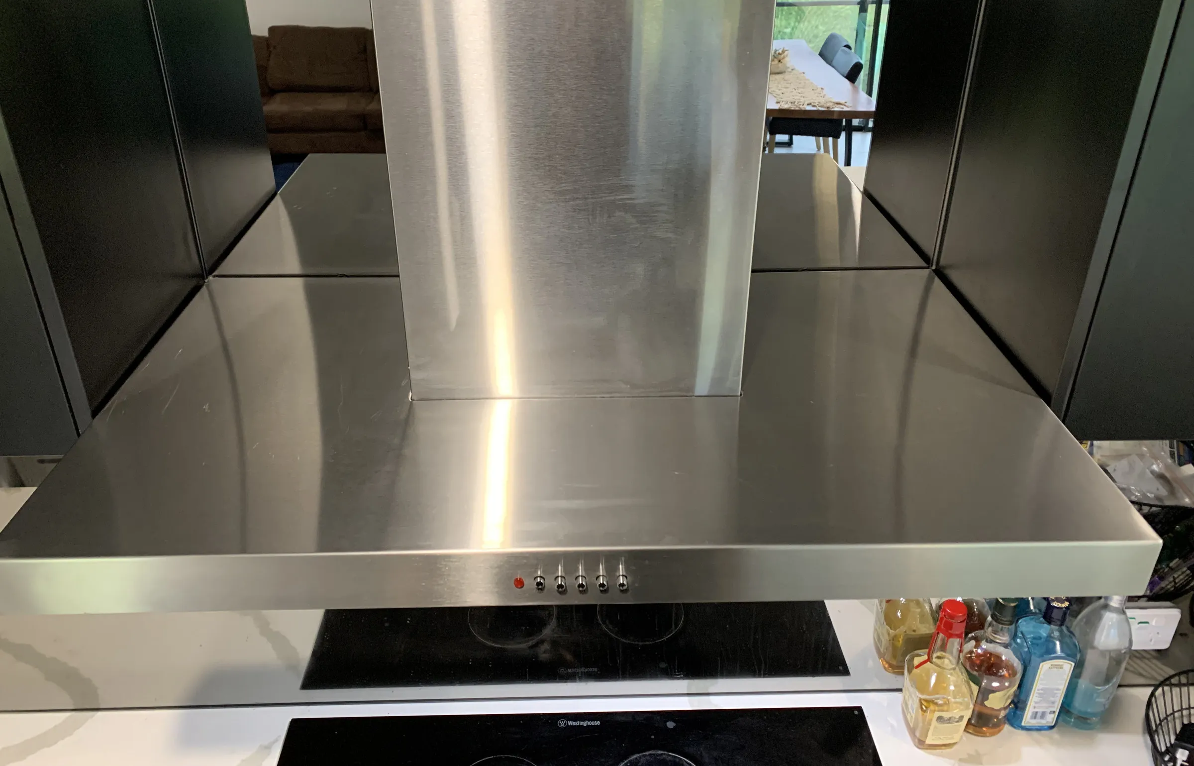 The same rangehood after cleaning, with polished stainless steel